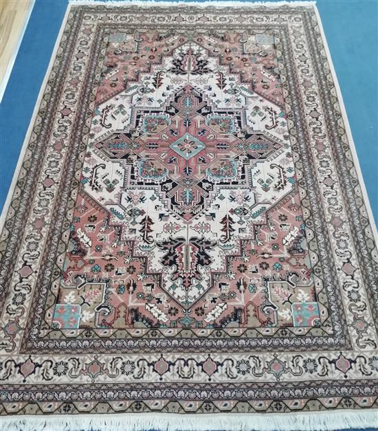 A Tabriz rug 274 x 190cm